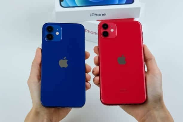 Comparison of blue and red iPhone 12 models showing rear cameras and build quality
