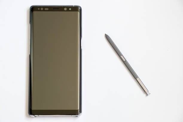 Samsung phone and stylus on white background with blank screen