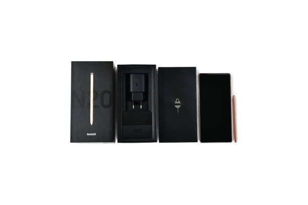 Samsung Note 20 unboxed with phone and accessories, screen turned off