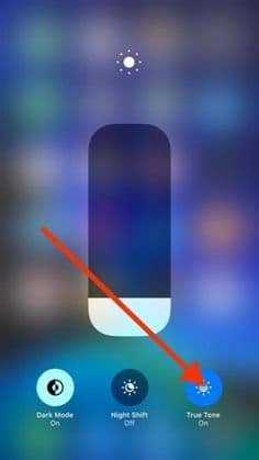 iPhone Control Center with True Tone toggle enabled for adaptive screen brightness.